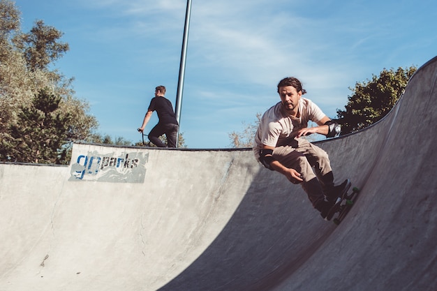 guys skate in the pool