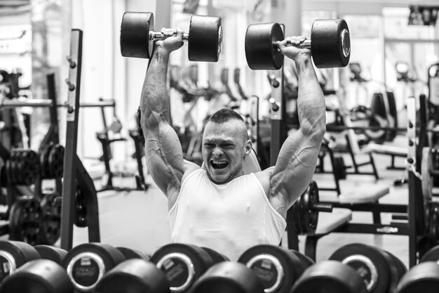 Gym. Handsome man during workout