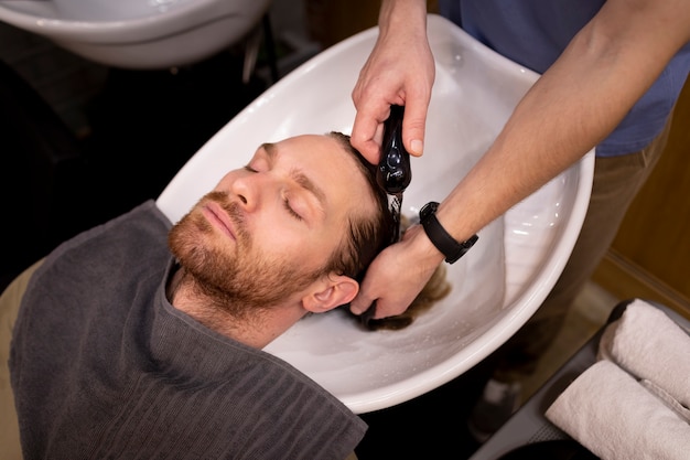 Hairdresser grooming their client