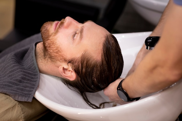 Hairdresser grooming their client