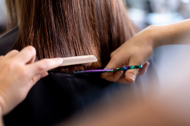 Hairdresser taking care of her client