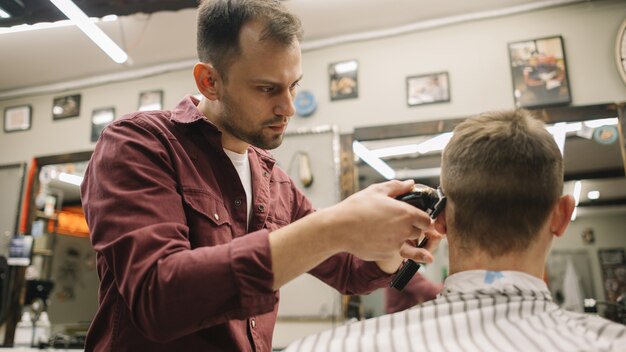 Hairstylist giving a haircut at barber shop