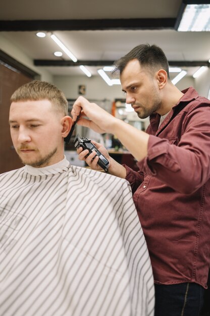 Hairstylist giving a haircut at barber shop