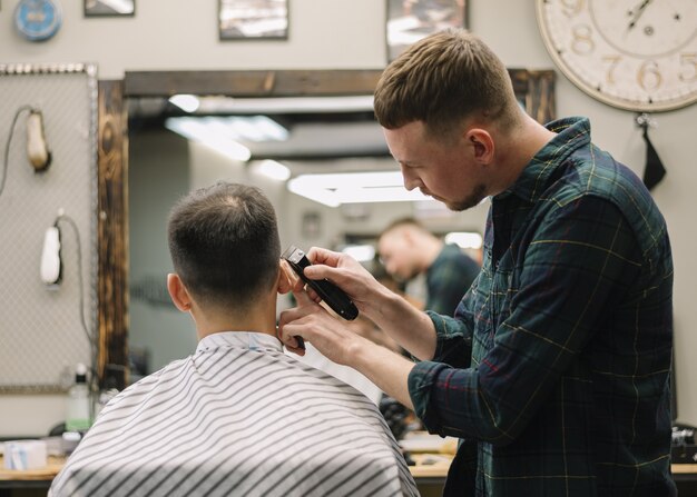 Hairstylist giving a haircut to a client