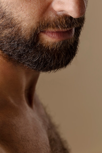 Hairy man in studio side view