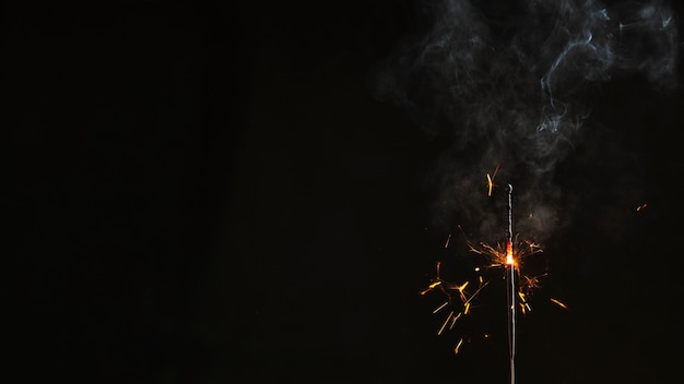 Free Photo half-burnt sparkler with smoke