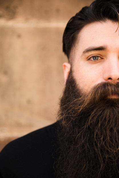 Free Photo half face portrait of a bearded man