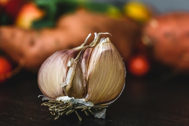 Half of garlic closeup on a blurred background