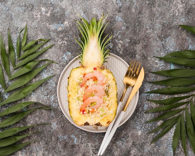 Half of pineapple with seafood