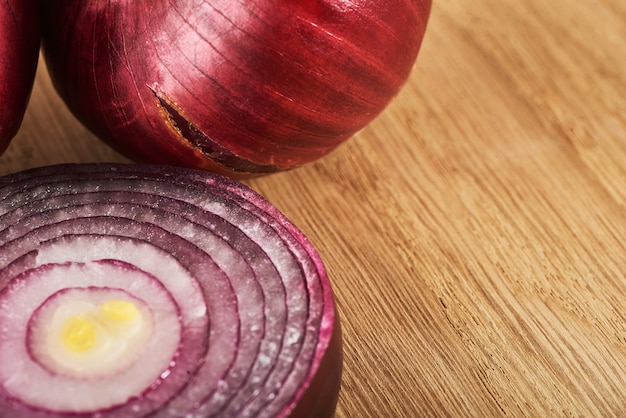 Half red onion on a wooden.