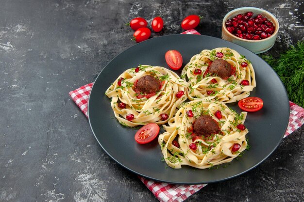 Half-top view cooked dough slices with meatballs on a gray background pasta meat color restaurant dinner cooking dish