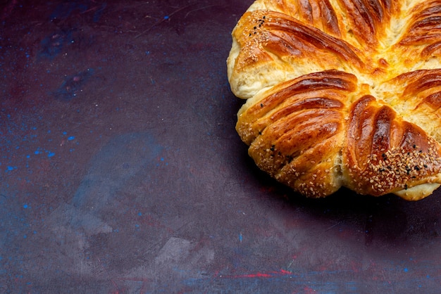 Free Photo half-top view delicious pastry baked bun on the dark desk.