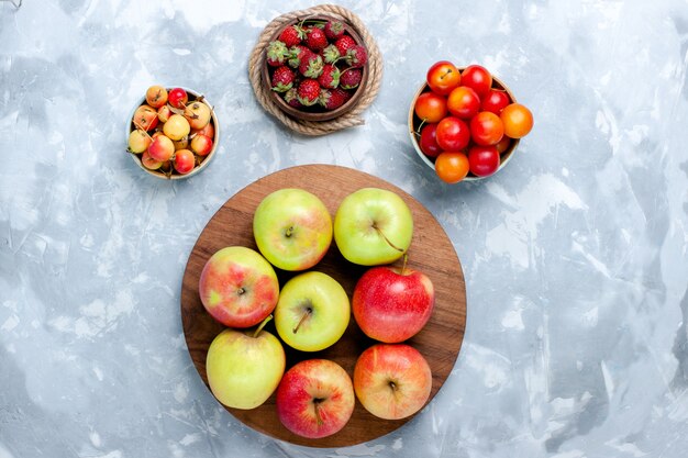 Half-top view fresh apples ripe mellow fruits on light white desk fruit food vitamine color fresh tree