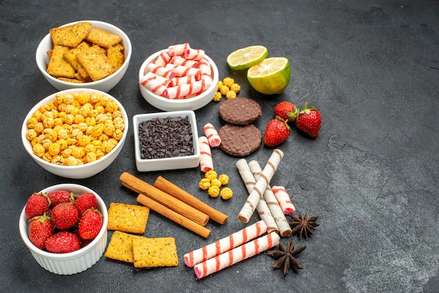 Free photo half-top view tasty snacks with vaious crackers fresh fruits