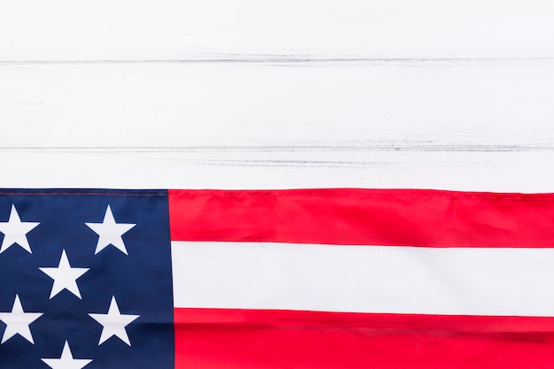 Free photo half of usa flag and half of white wooden table