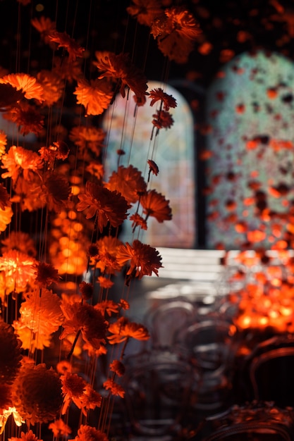 Hall decorated with chrysanthemums on threads