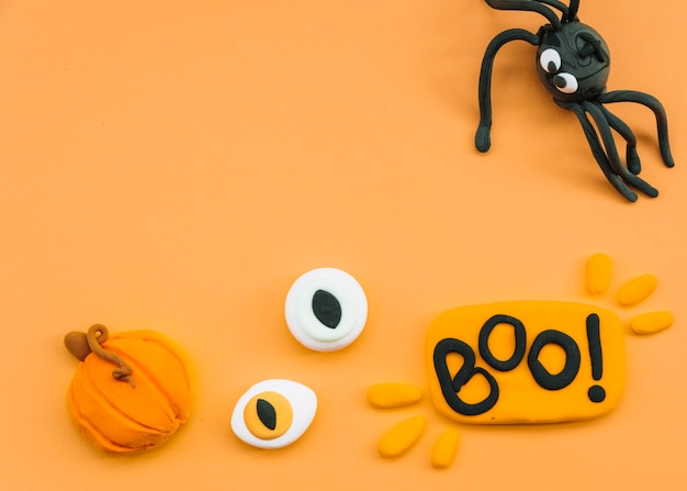 Free photo halloween arrangement with plasticine spider and eyes