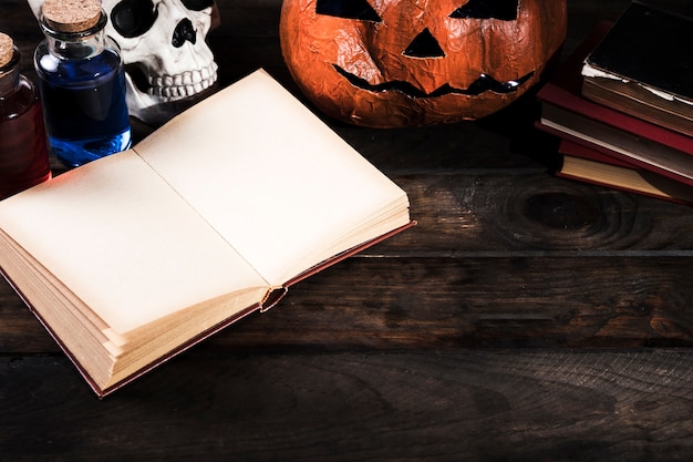 Halloween attributes on wooden desk