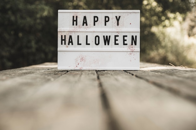 Free Photo halloween board placed on wooden desk 