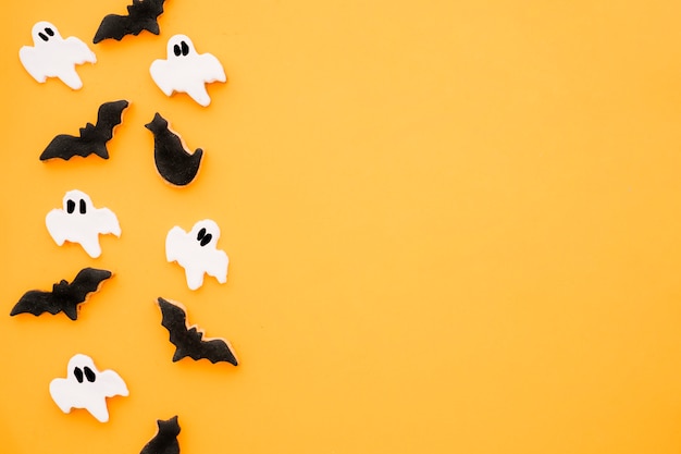 Halloween composition with bats and ghosts