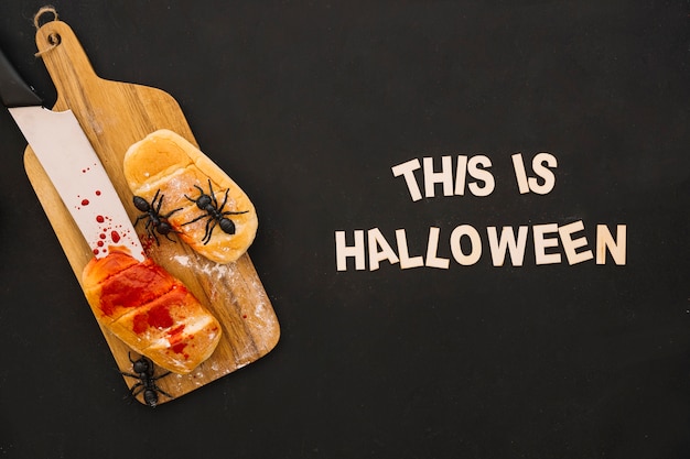 Free photo halloween composition with bread and letters