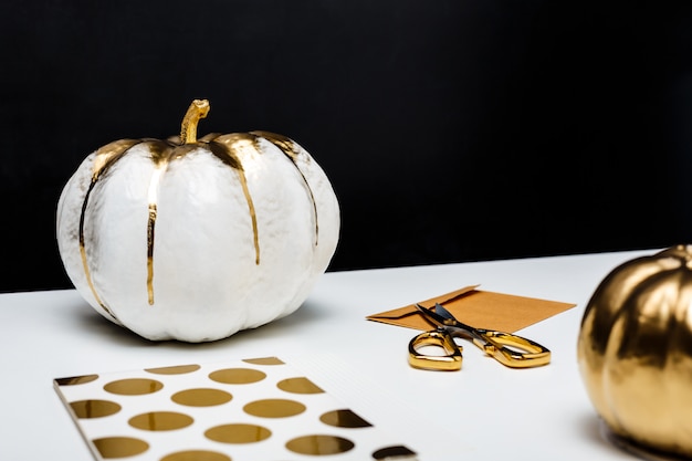 Free Photo halloween decor on white table over black surface