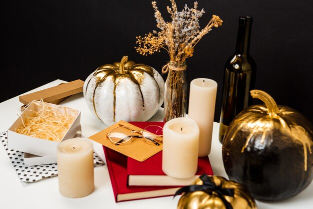 Halloween decor on white table over black wall