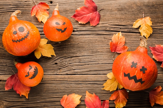 Free photo halloween decoration pumpkins and leaves