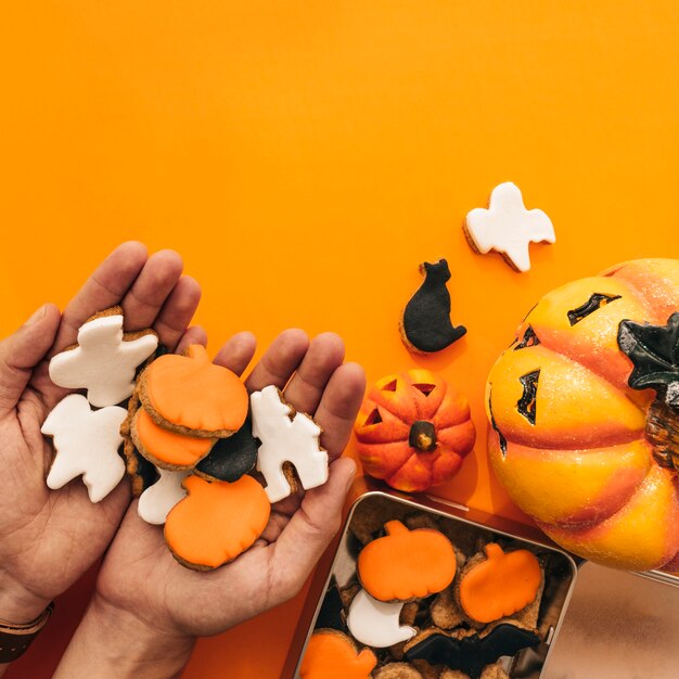 Halloween decoration with hands holding cookies