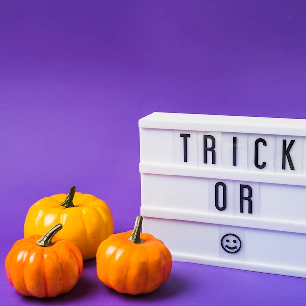 Free photo halloween fresh pumpkins and plastic board