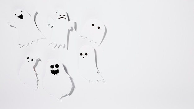 Halloween ghosts made of paper with funny faces