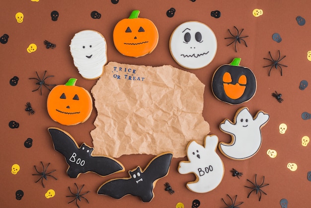 Free Photo halloween gingerbreads around wrinkled craft paper