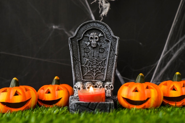 Free Photo halloween graveyard concept with smiling pumpkins