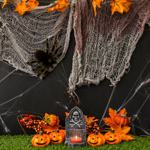 Free Photo halloween graveyard with net and pumpkins