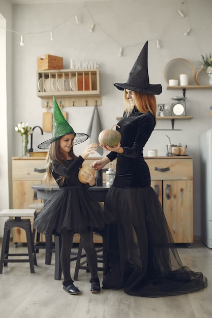 Free Photo halloween. mother and daughter in halloween costume. family at home.