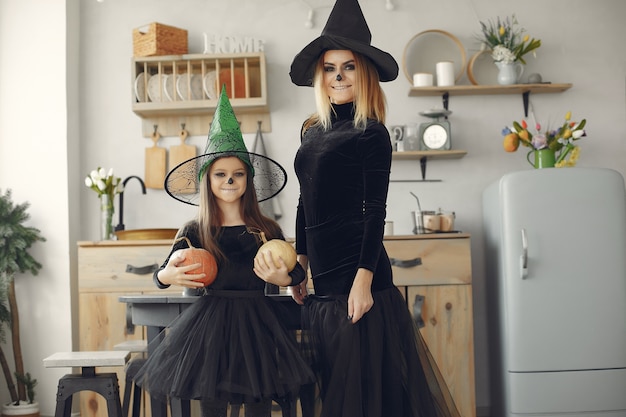 Free Photo halloween. mother and daughter in halloween costume. family at home.