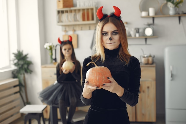 Free Photo halloween. mother and daughter in halloween costume. family at home.