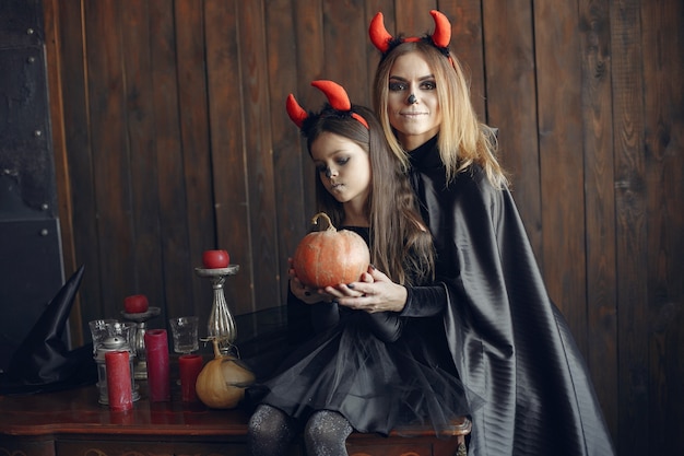 Free Photo halloween. mother and daughter in halloween costume. family at home.