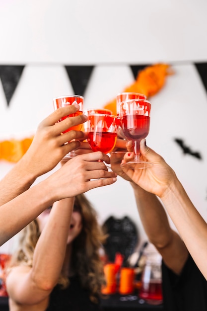 Free Photo halloween party with red drinks in glasses