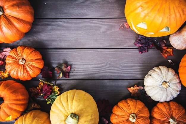 Halloween pumpkins on wooden background