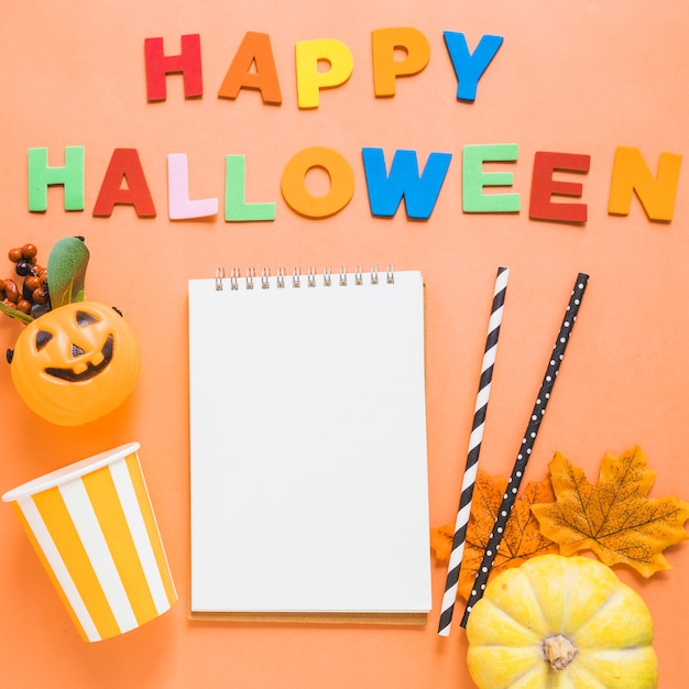 Free photo halloween stuff and writing around notebook