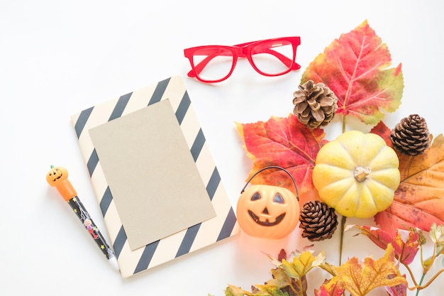 Free Photo halloween symbols near stationery and glasses