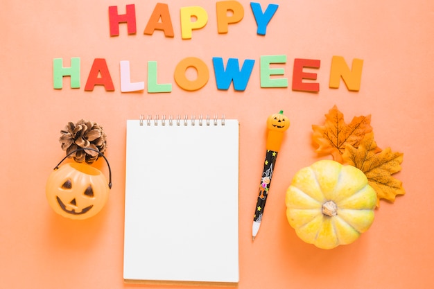 Free Photo halloween symbols near writing and stationery