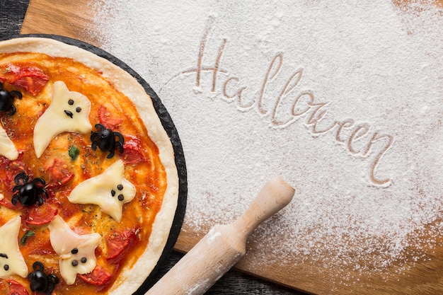 Free photo halloween written with cooking flower