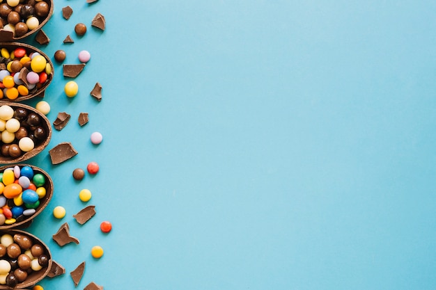 Halves of chocolate eggs with sweets