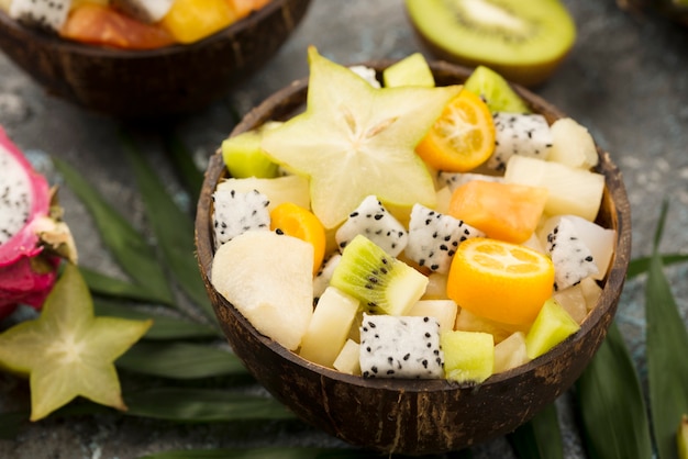 Halves of coconut filled with fruit salad close-up