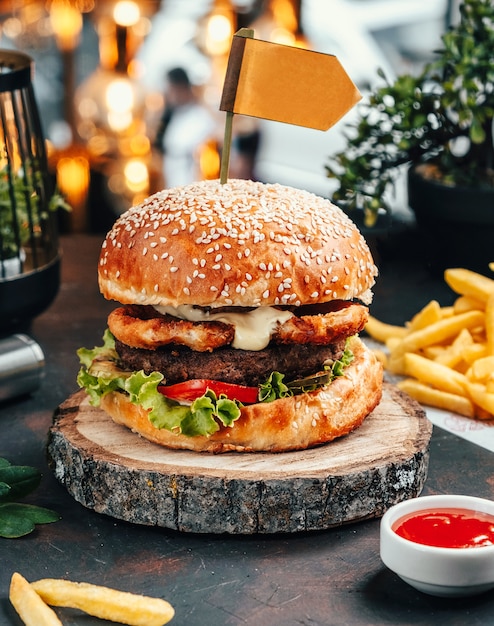 Hamburger with french fries on the table