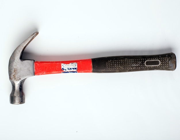 Free Photo hammer on a white surface