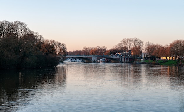 Free Photo hampton court bridge over the river thames at dusk