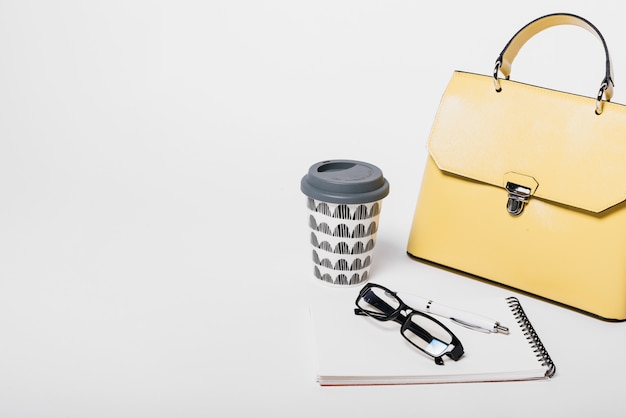 Free photo hand bag and coffee composition